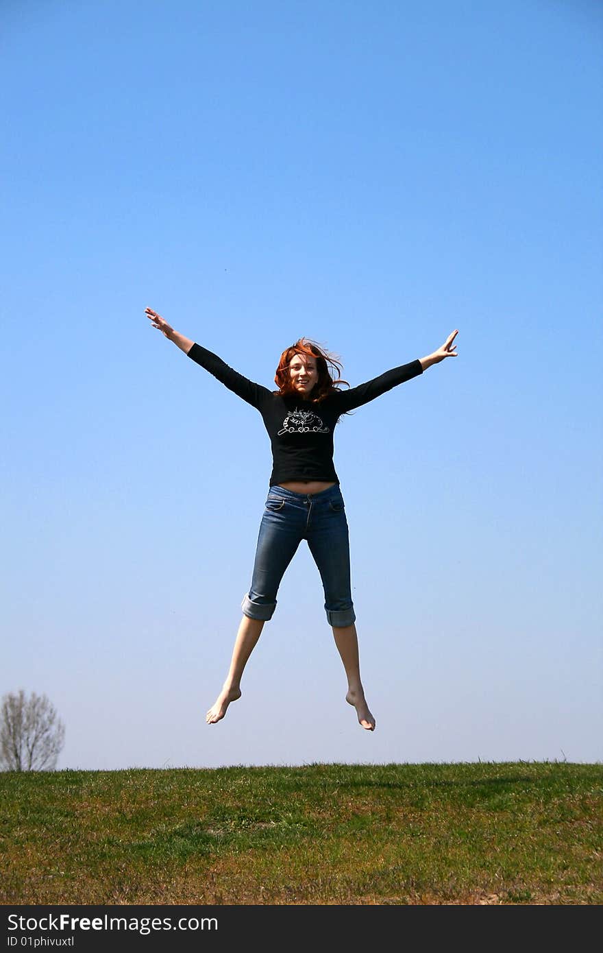 The girl taken in a jump like hanging in the air. The girl taken in a jump like hanging in the air