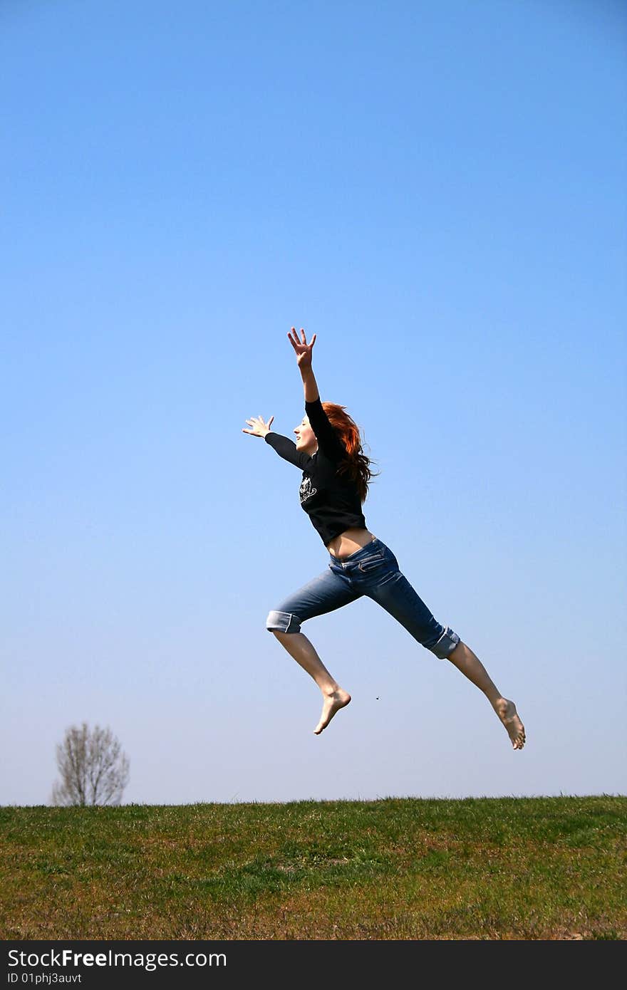 The girl taken in a jump like hanging in the air. The girl taken in a jump like hanging in the air