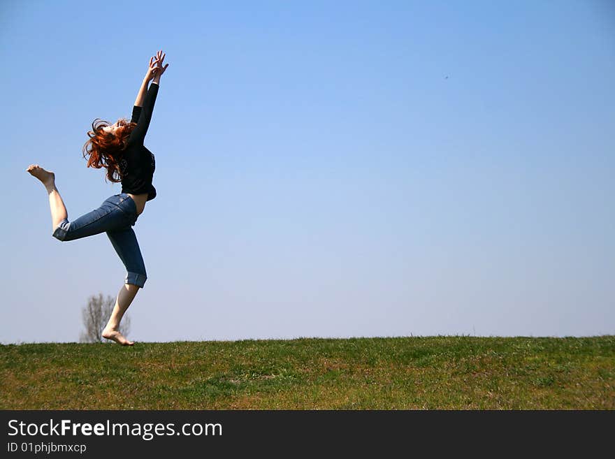 The girl taken in a jump like hanging in the air. The girl taken in a jump like hanging in the air