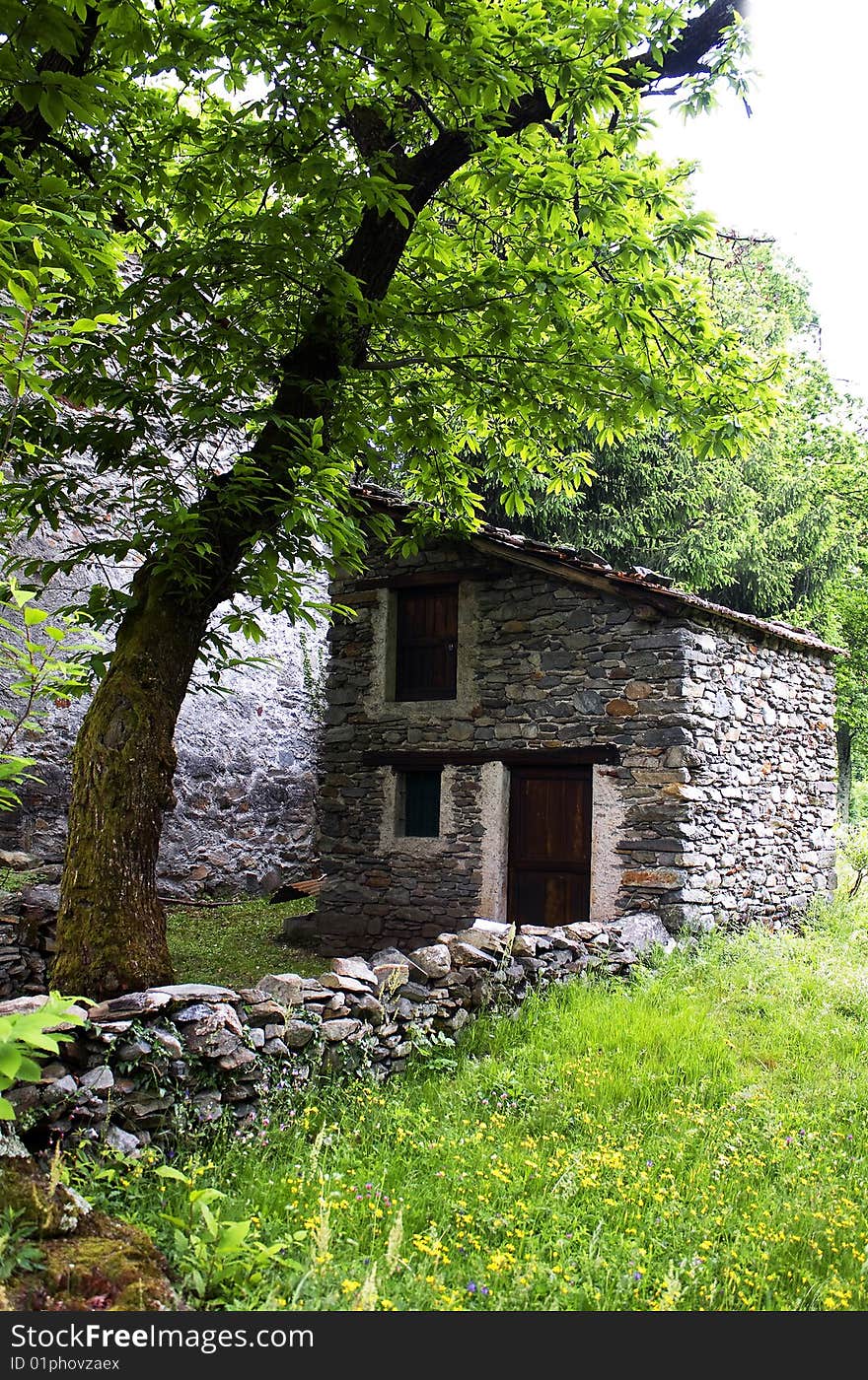 Grass with old stone hut. Grass with old stone hut