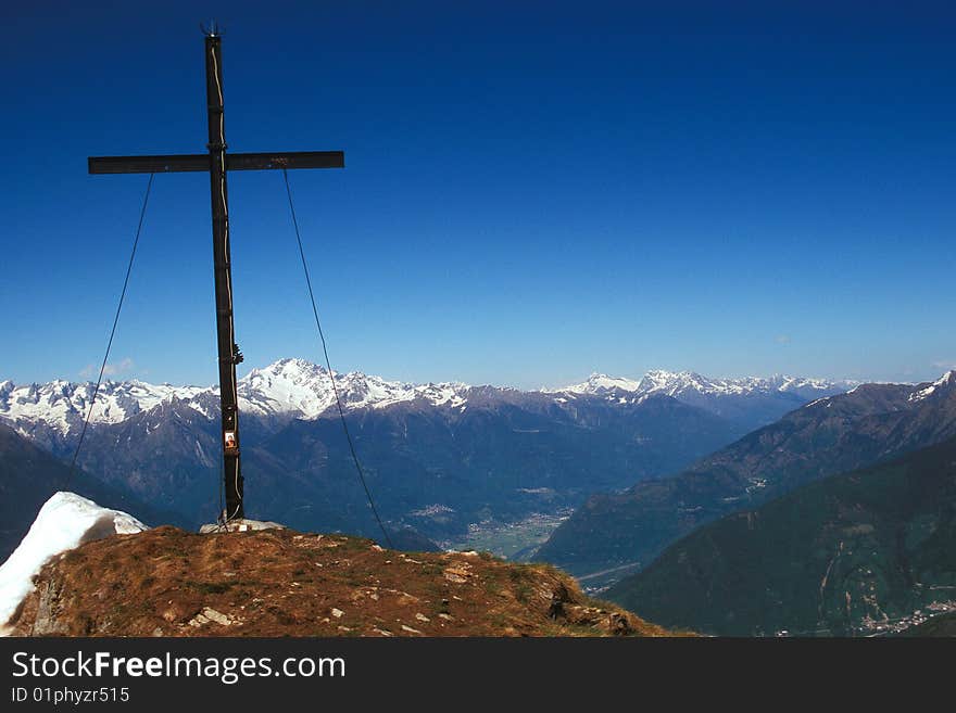 Cross on top of the mountain on the Rhaetian Alps (Sondrio - Italy)