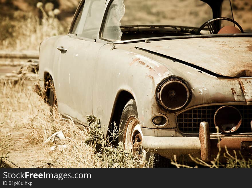 Abandoned vintage car in the middle of nowhere