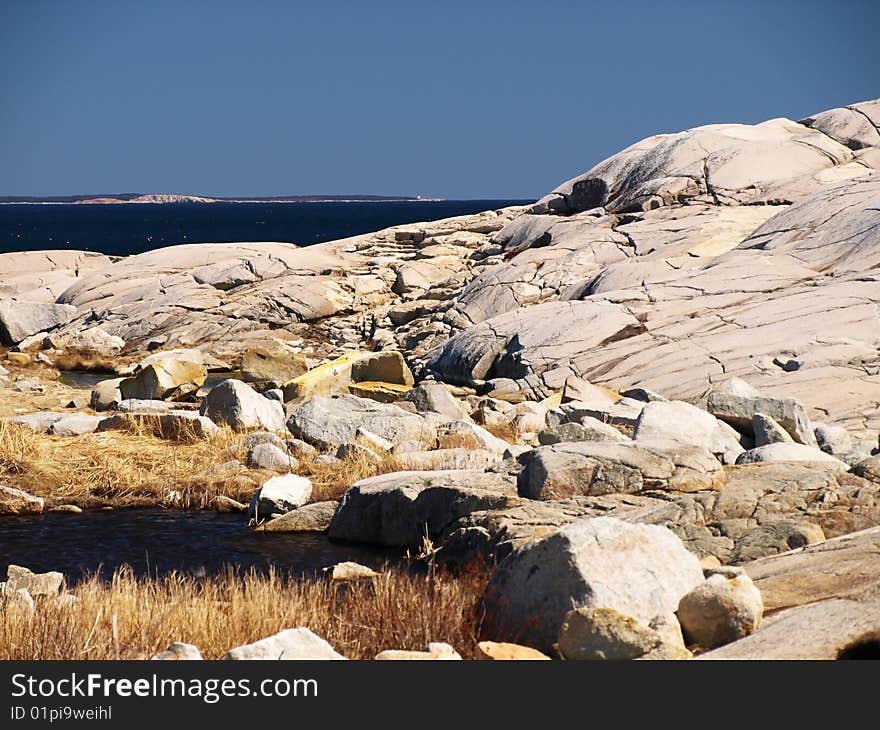 Ocean landscape with blue sky and granite rock. Ocean landscape with blue sky and granite rock