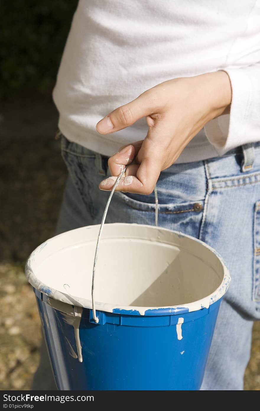 Woman Holding Paint Bucket