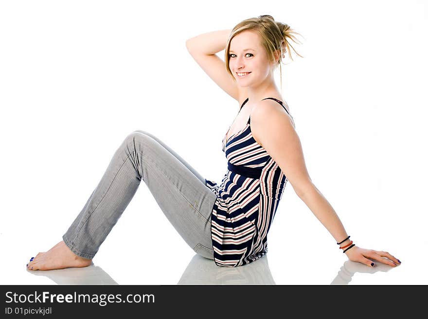 Cute fifteen year old girl holding her hair up. Cute fifteen year old girl holding her hair up.