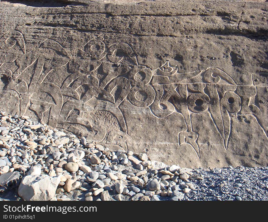 Prayer mantra on a rock