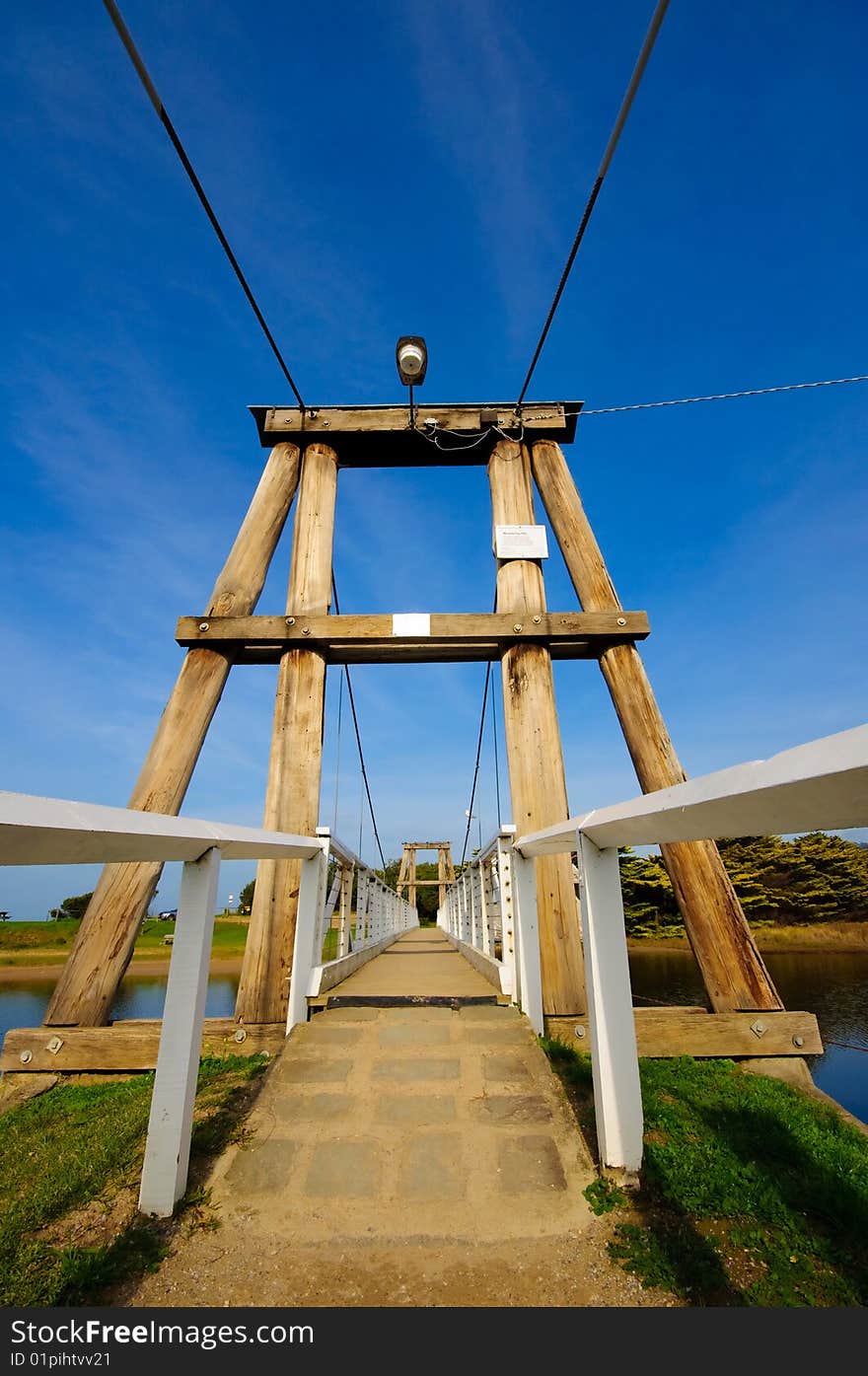 Wooden pedestrian bridge across Erskine river in Australia