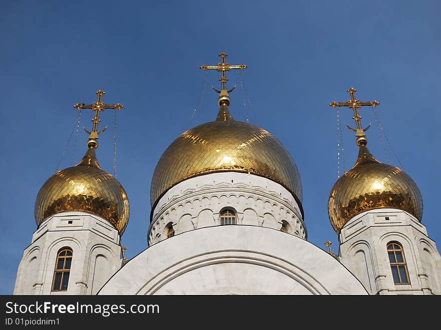 Crosses of orthodox church against blue sky