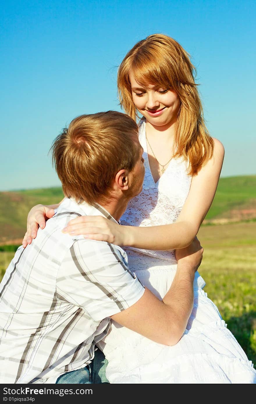 Happy young loving couple outdoor in summertime