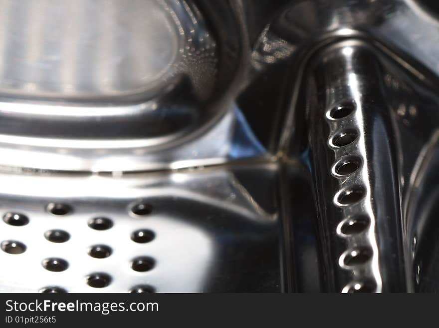 Abstract metal dark background with lot of small round holes standing in row. Abstract metal dark background with lot of small round holes standing in row