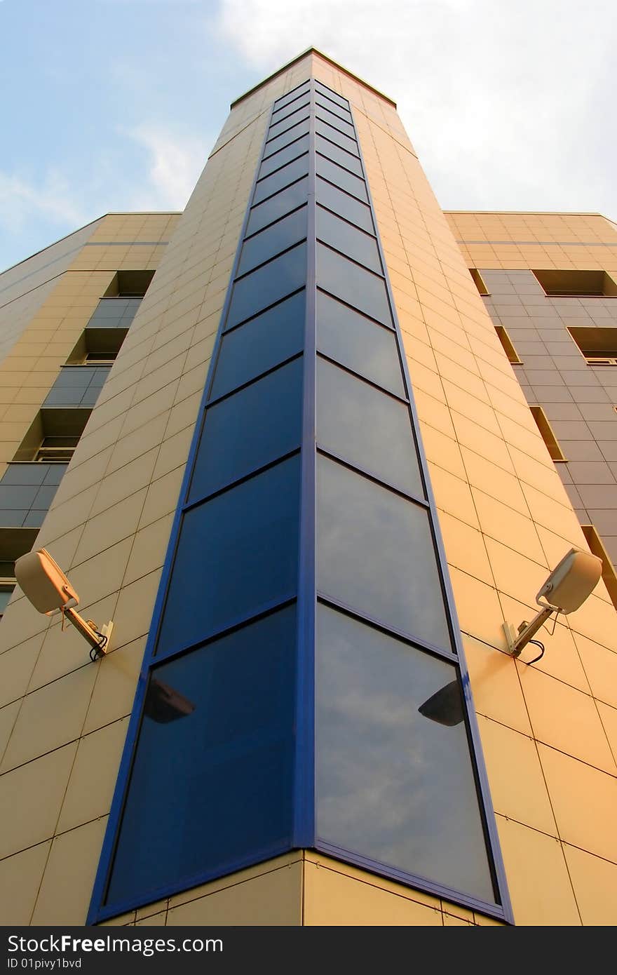 Tall modern building with blue glass windows. Tall modern building with blue glass windows.