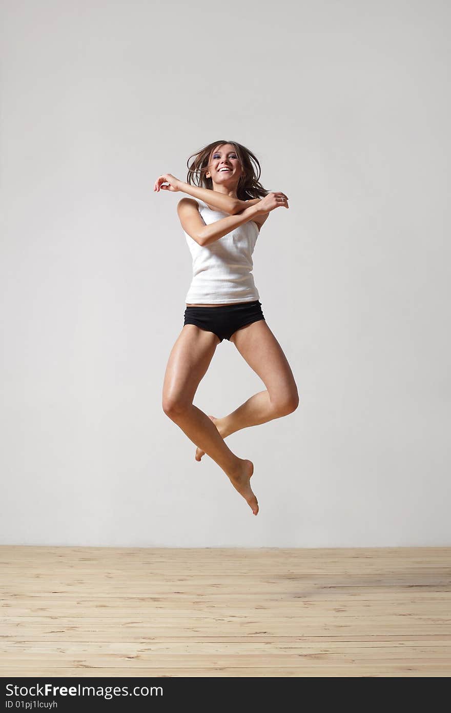 Modern style dancer posing on studio background. Modern style dancer posing on studio background