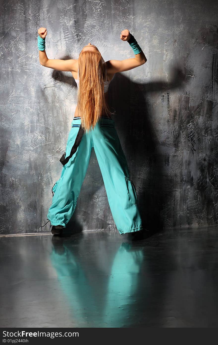 Modern style dancer posing on studio background. Modern style dancer posing on studio background