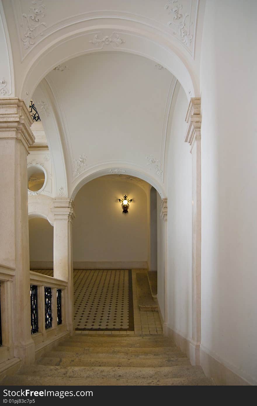 Classic stairway with arch in castle