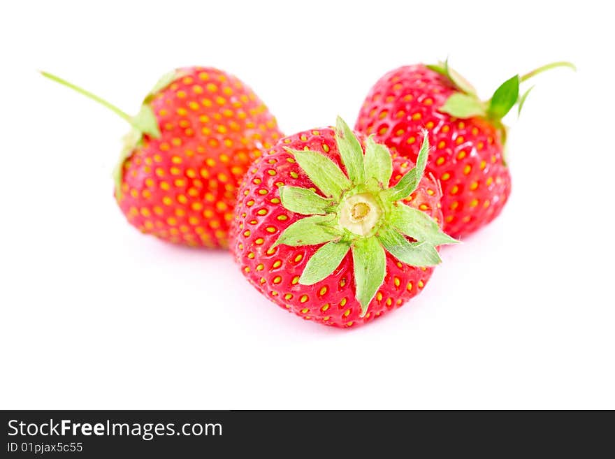 Three fresh srawberies isolated on white. Three fresh srawberies isolated on white