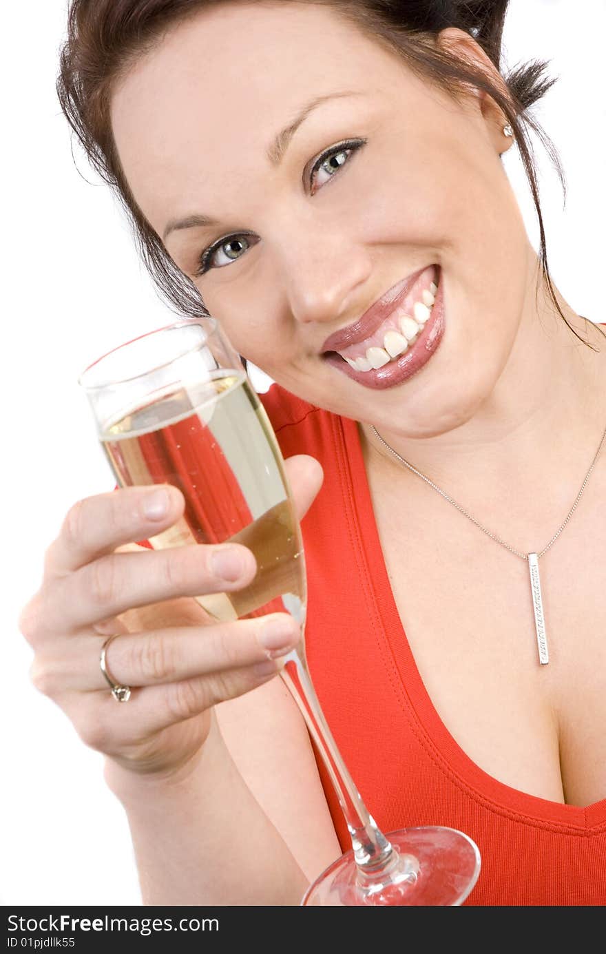 Happy brunette with a glass of champagne isolated on white