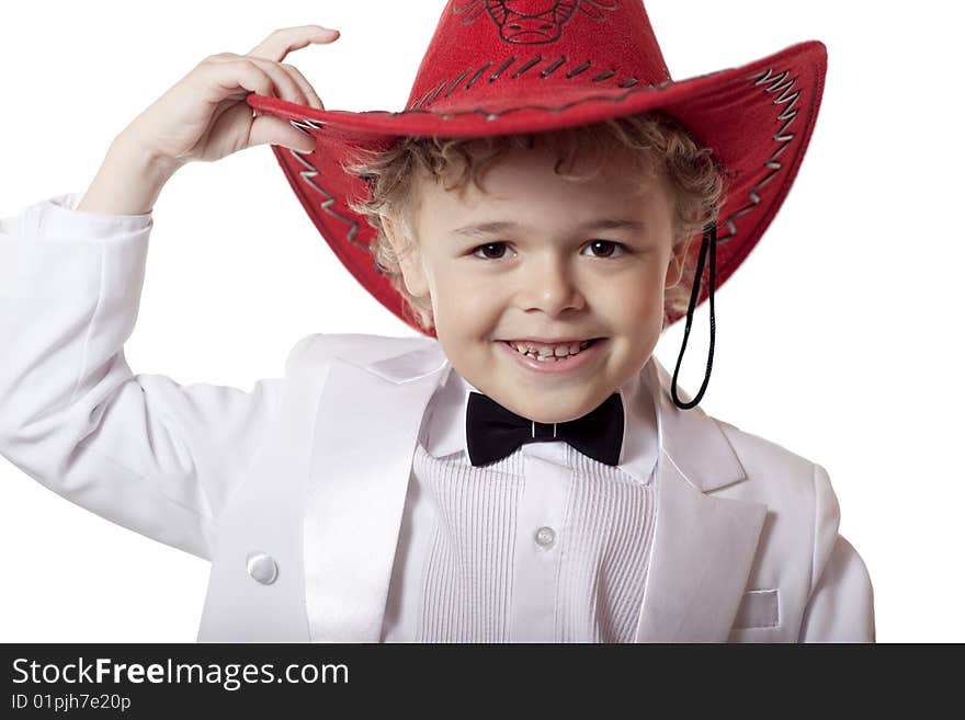 A smiling boy in a rad stetson (hat)