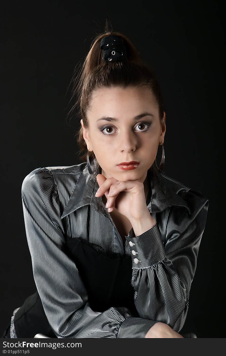 Portrait of young girl with lean on hers arm in dark. Portrait of young girl with lean on hers arm in dark