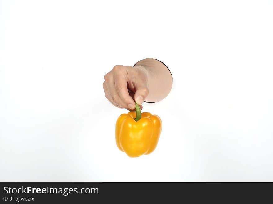 Man's hand is holding paprika. Man's hand is holding paprika