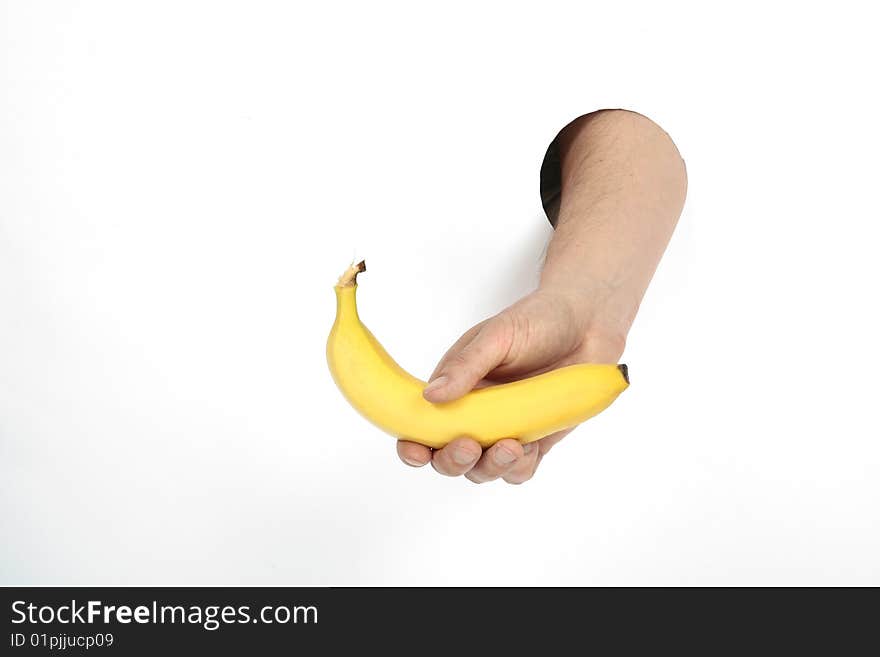 yellow banana in man's hand