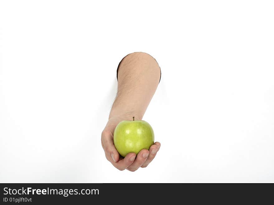 Hand is holding green apple