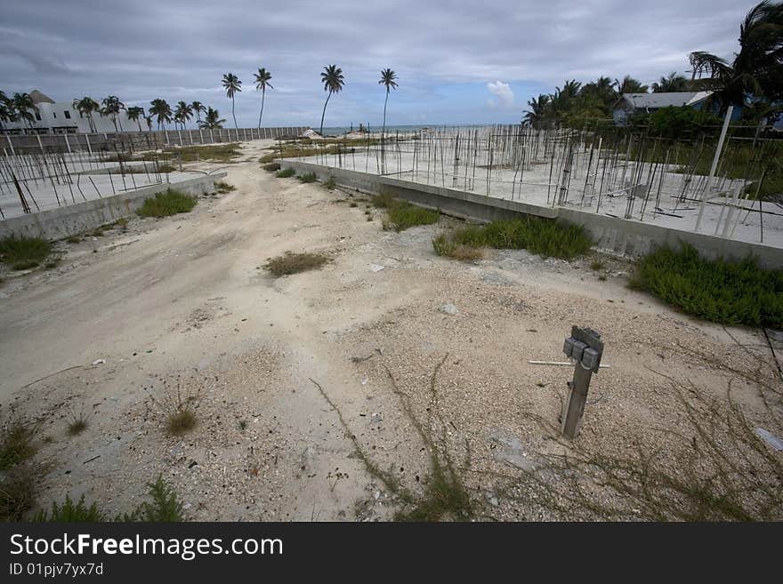 An abandoned construction site sits at the water's edge in the Gulf of Mexico.