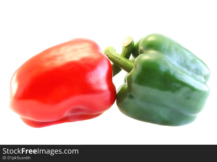 Red and green pepper, on a white background.