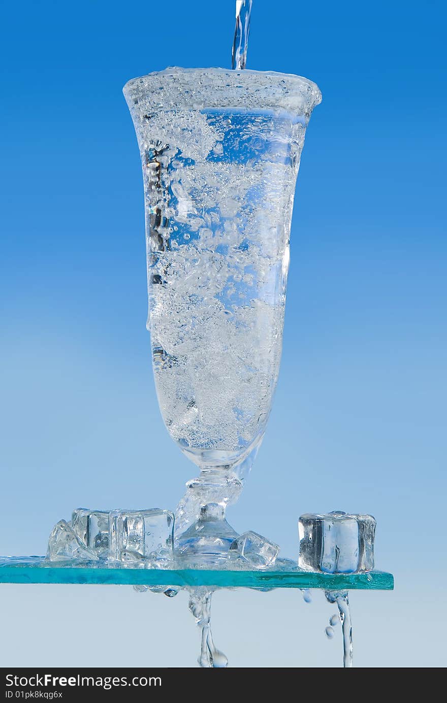 Glass of water on a light blue background. Glass of water on a light blue background