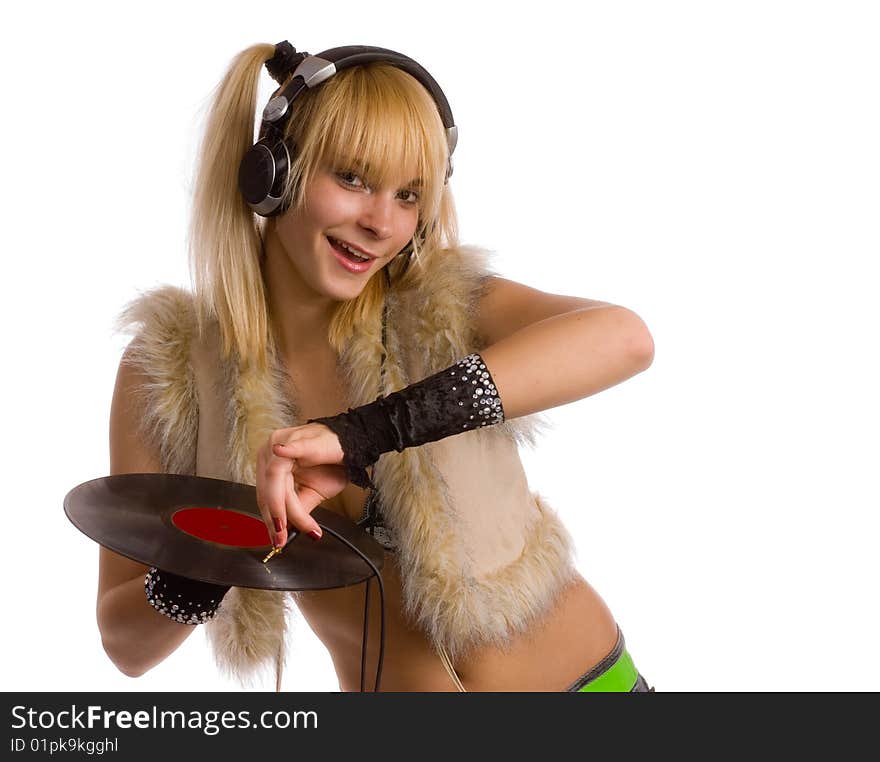 Young girl in  waistcoats of the fur, with plate in hand and headphones. Young girl in  waistcoats of the fur, with plate in hand and headphones