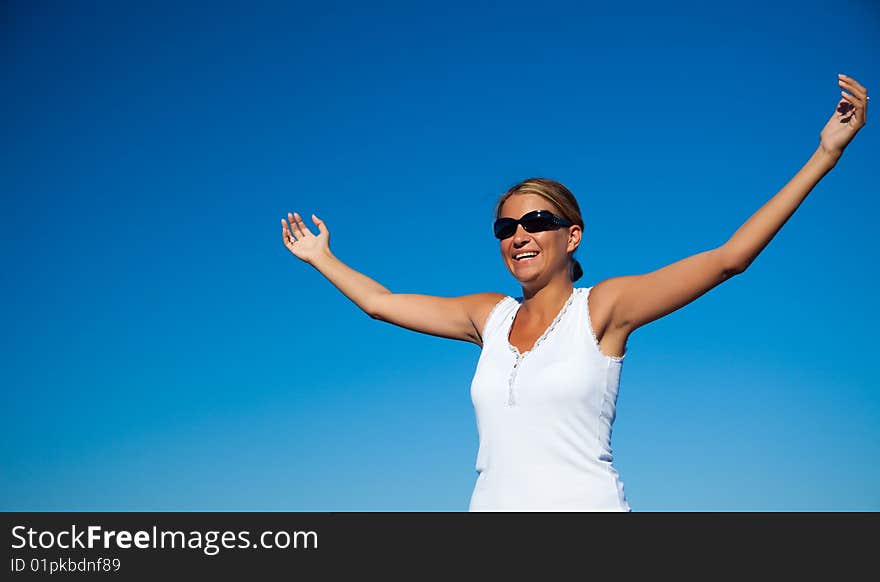 Pretty young woman standing on beach