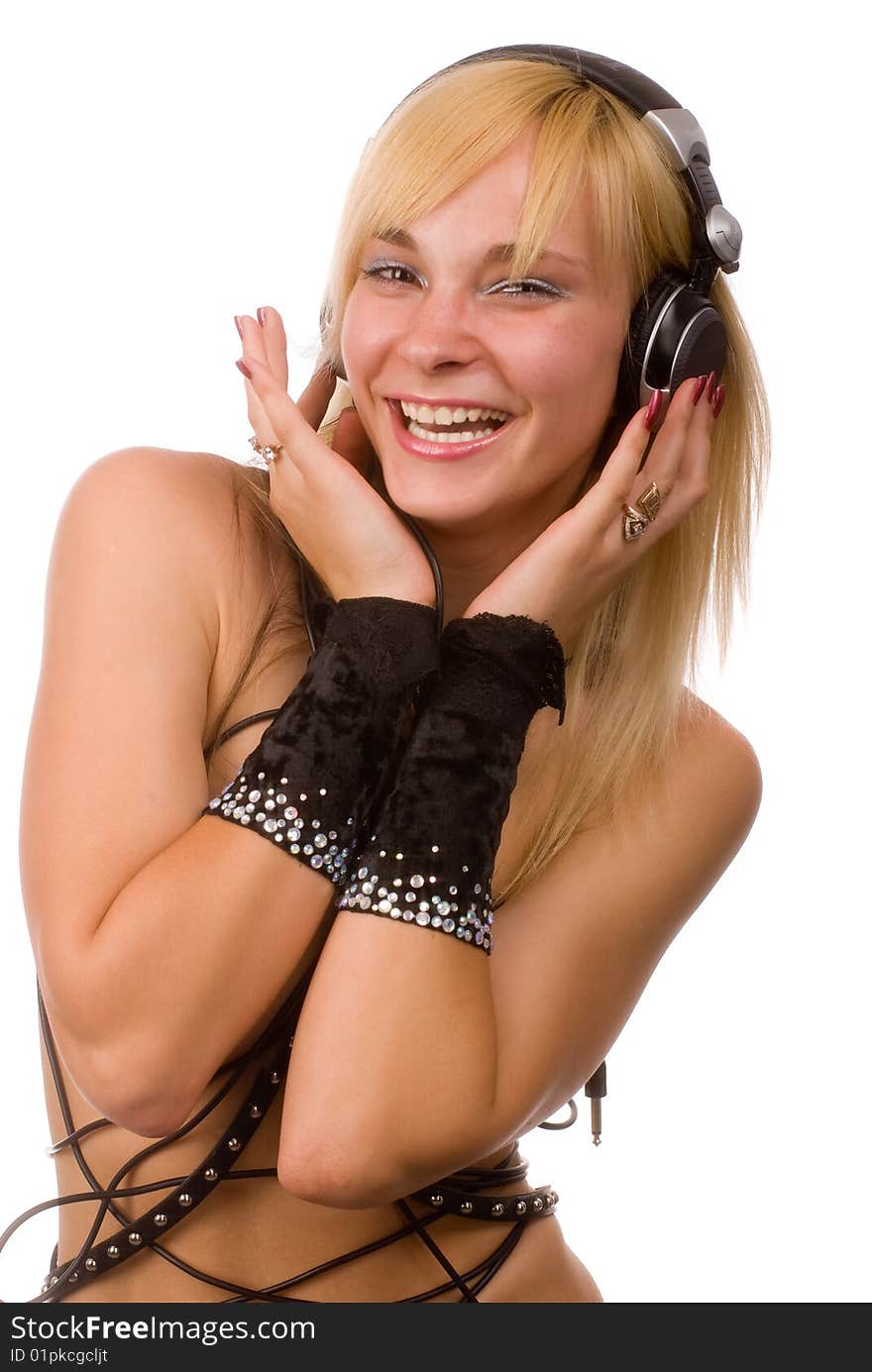 Portrait of a young beautiful girl crocked cables and headphones. Portrait of a young beautiful girl crocked cables and headphones