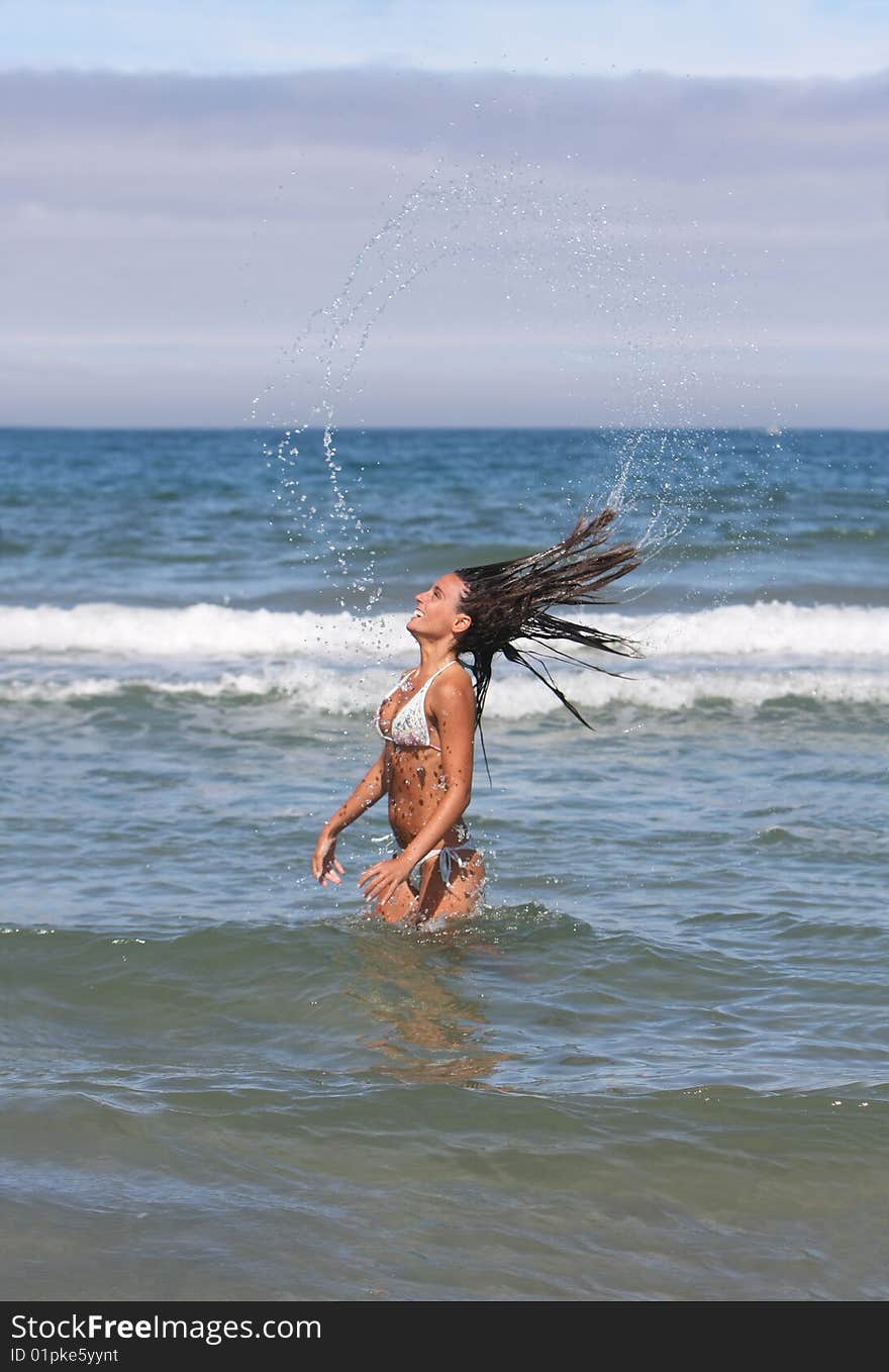 Girl with long hair in the sea