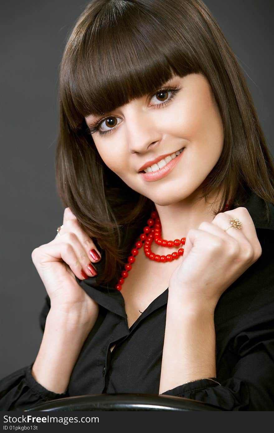 Close-up portrait of a beautiful woman on a black background