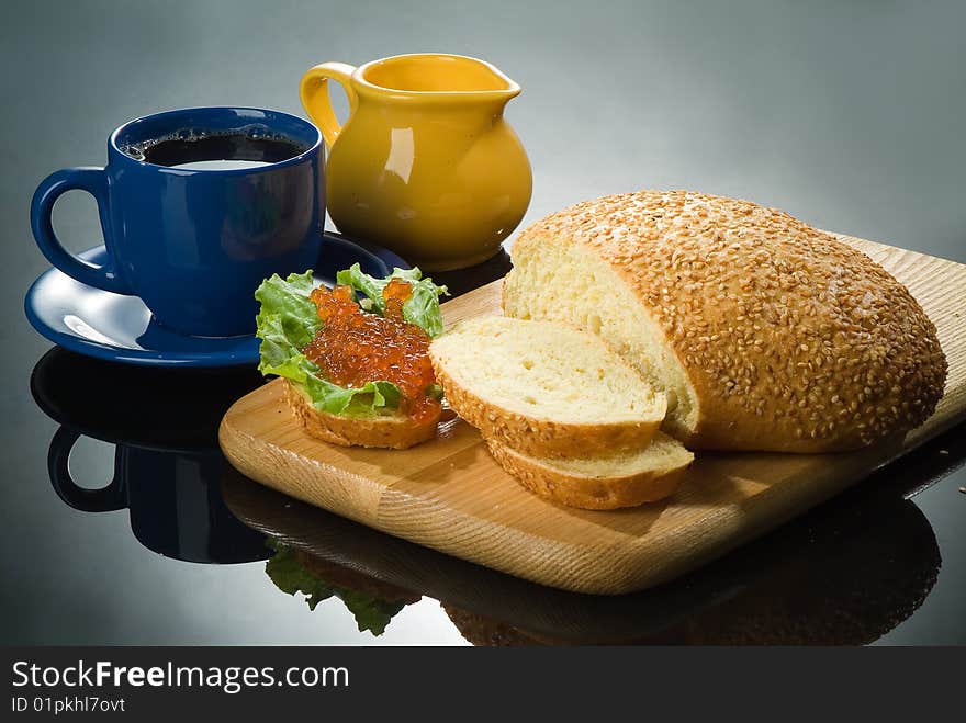 Still life with red caviar and cup of tea. Still life with red caviar and cup of tea