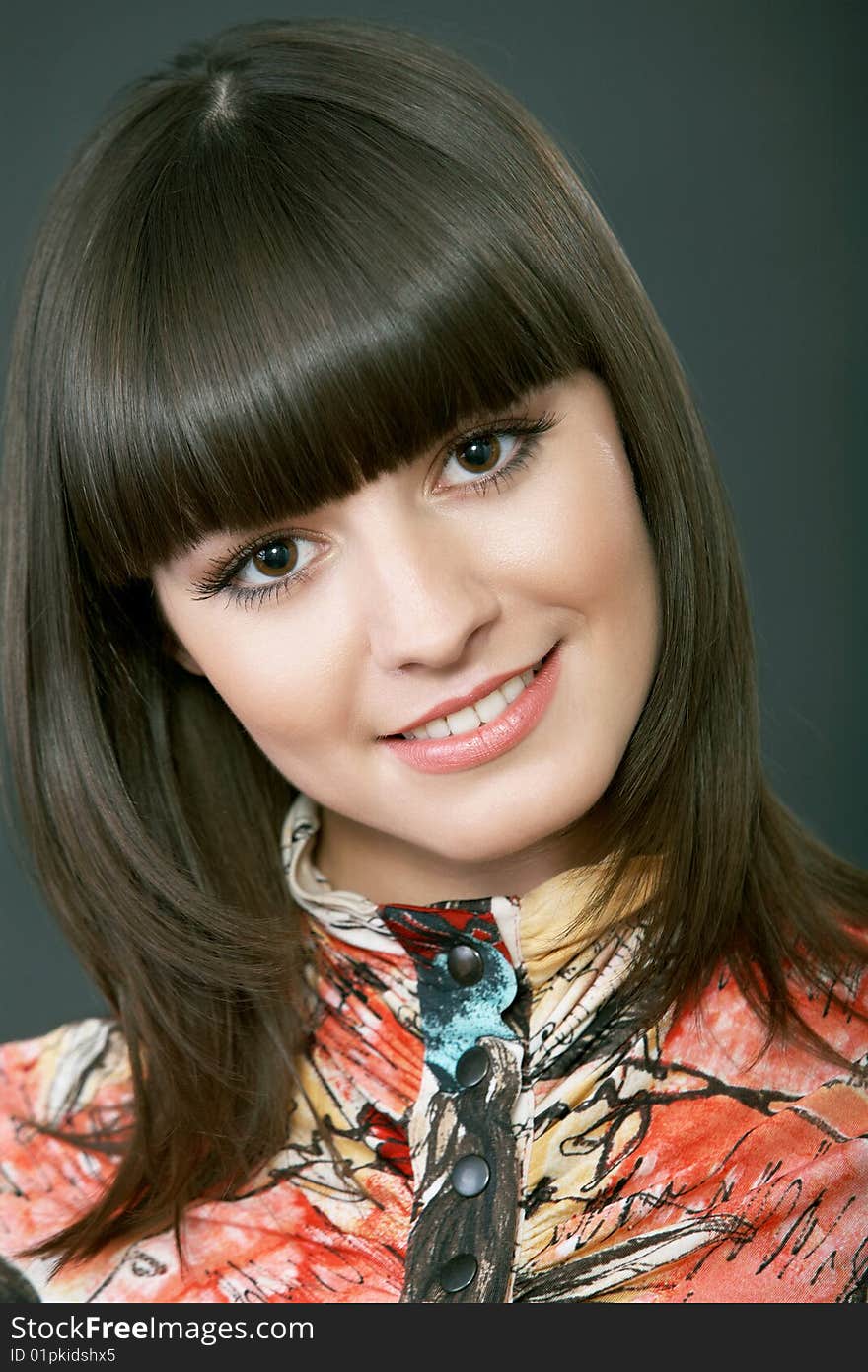 Close-up portrait of a beautiful woman on a black background