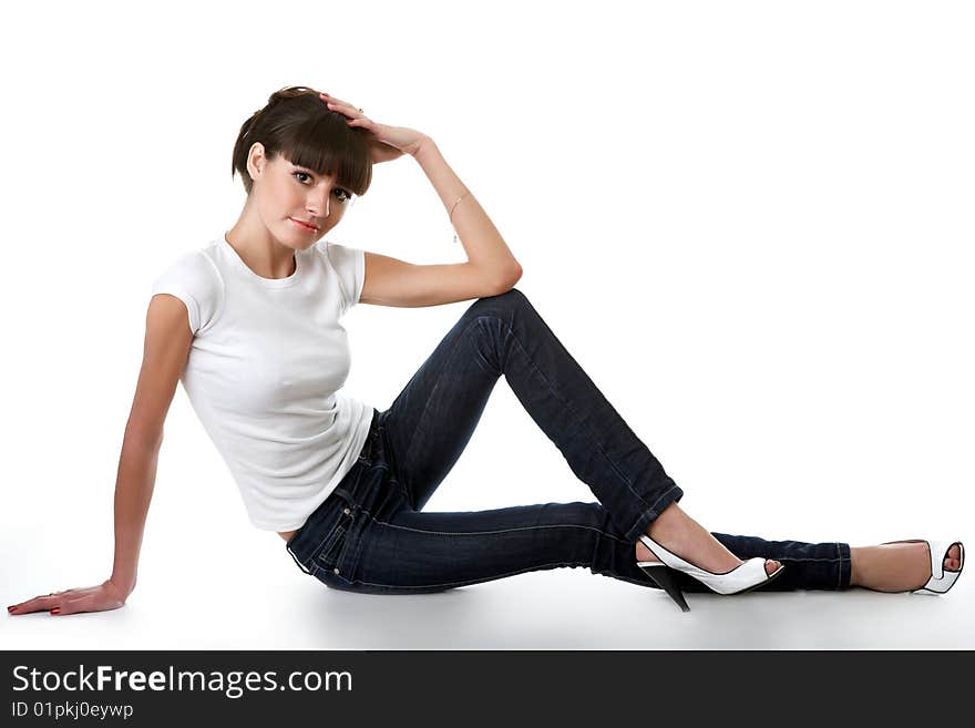 Beautiful young adult girl posing in a studio