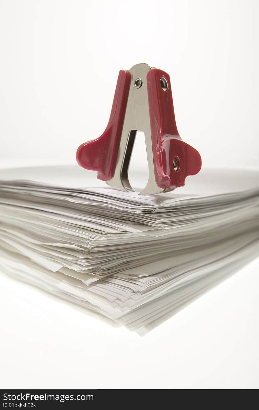 Staple puller on a sheaf of paper.