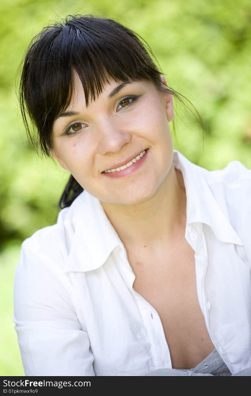 Happy woman relaxing on grass. Happy woman relaxing on grass