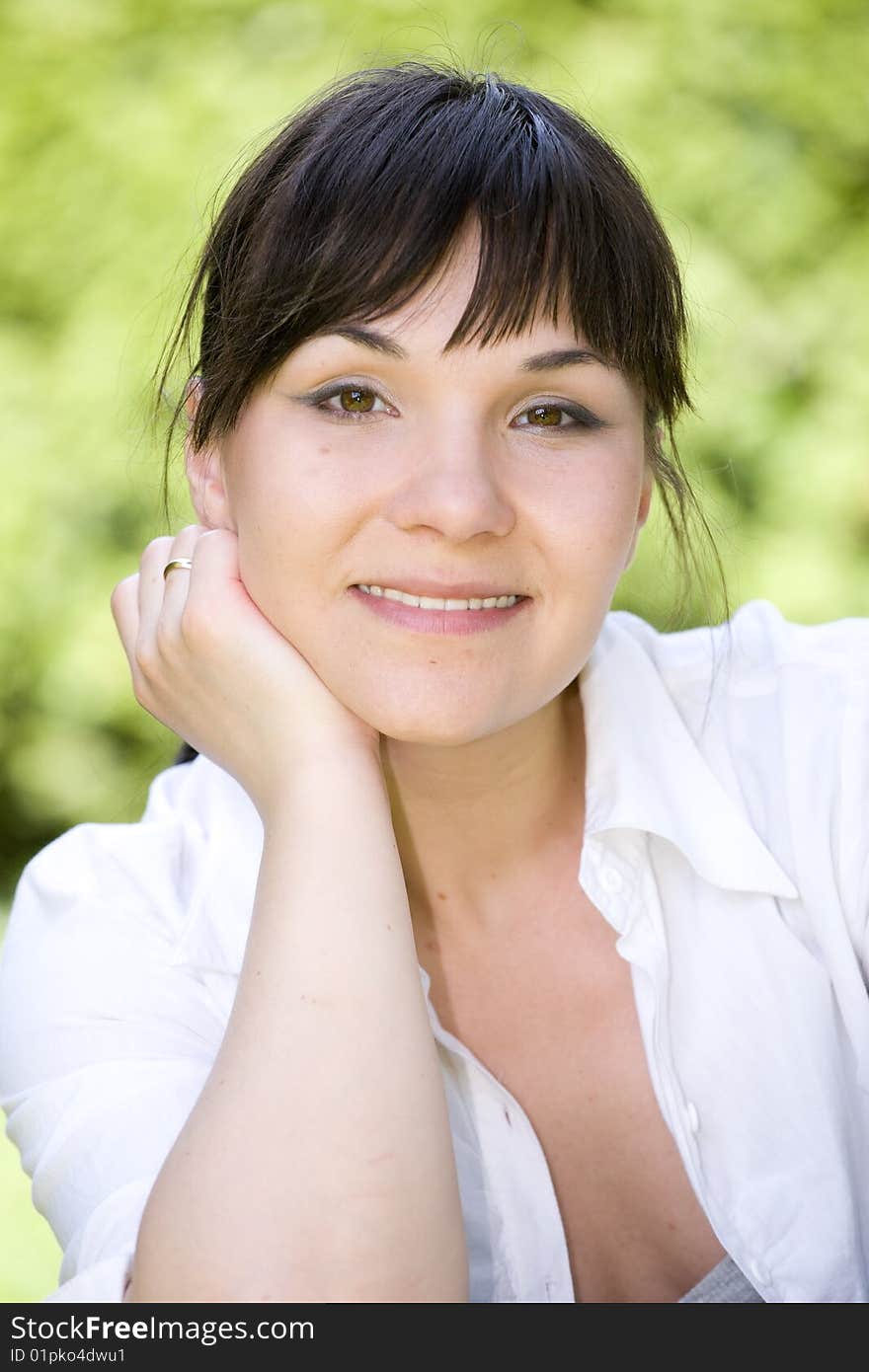 Happy woman relaxing on grass. Happy woman relaxing on grass