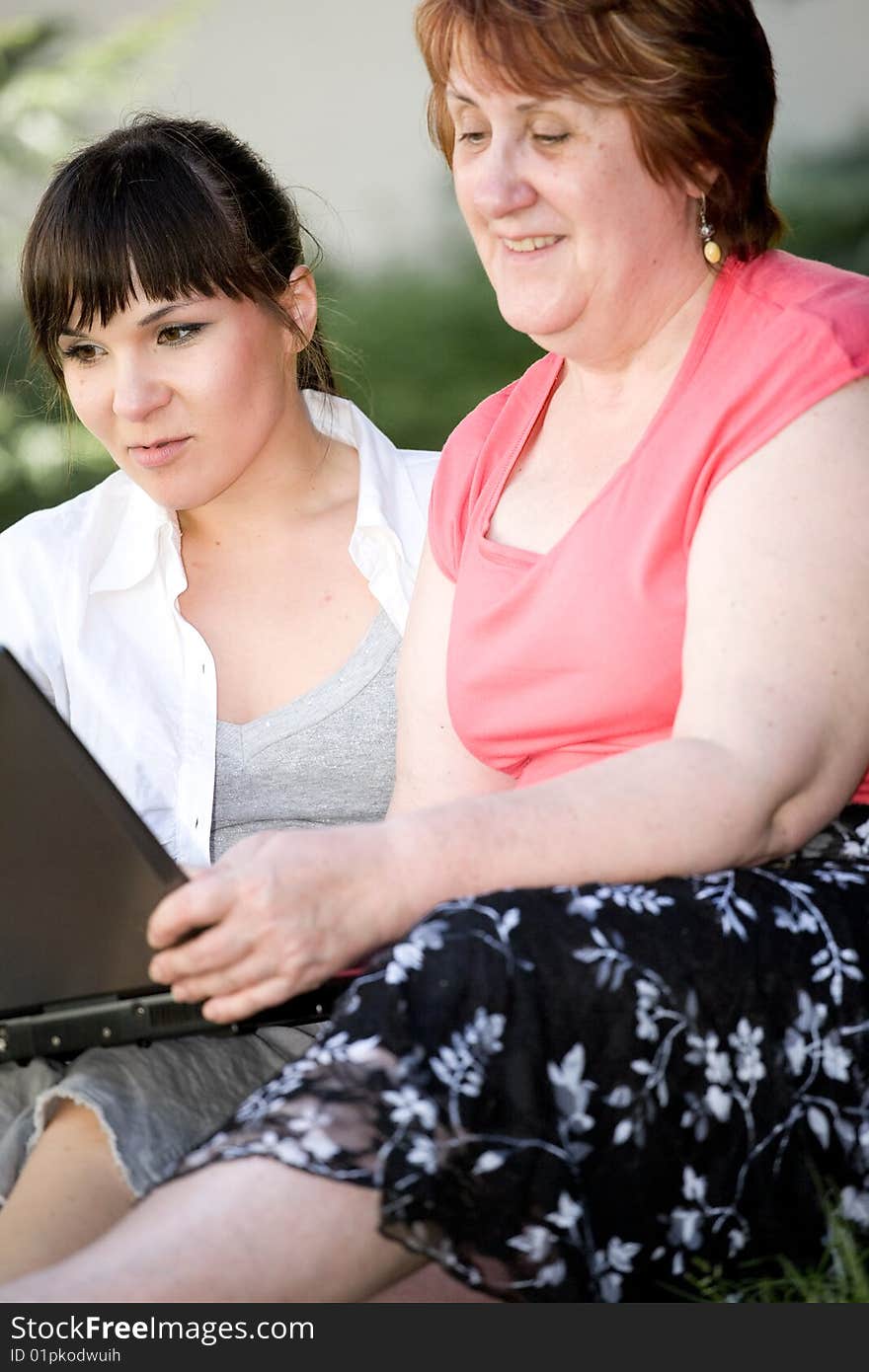 Mother And Daughter With Laptop