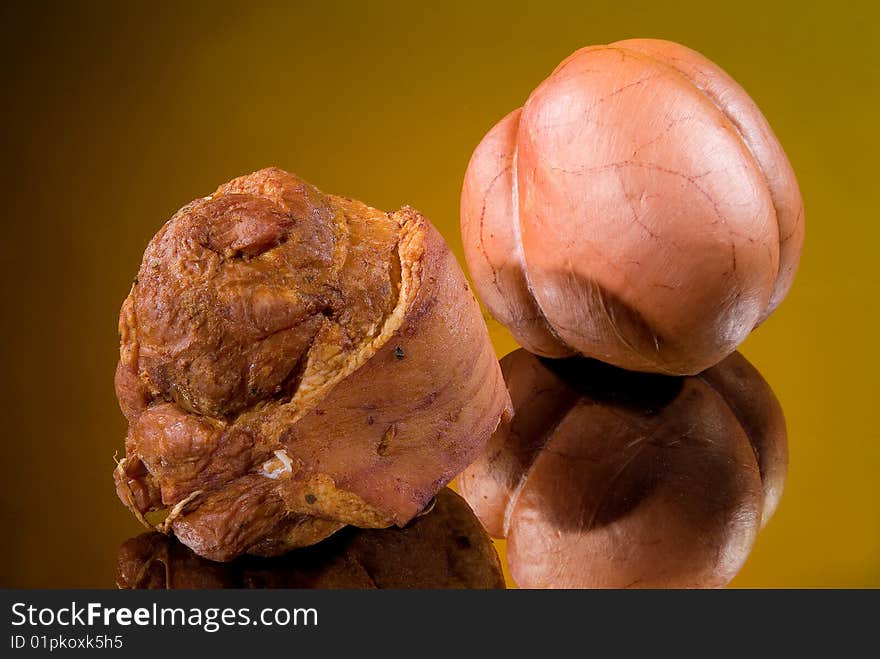 Sausages on a black glass background