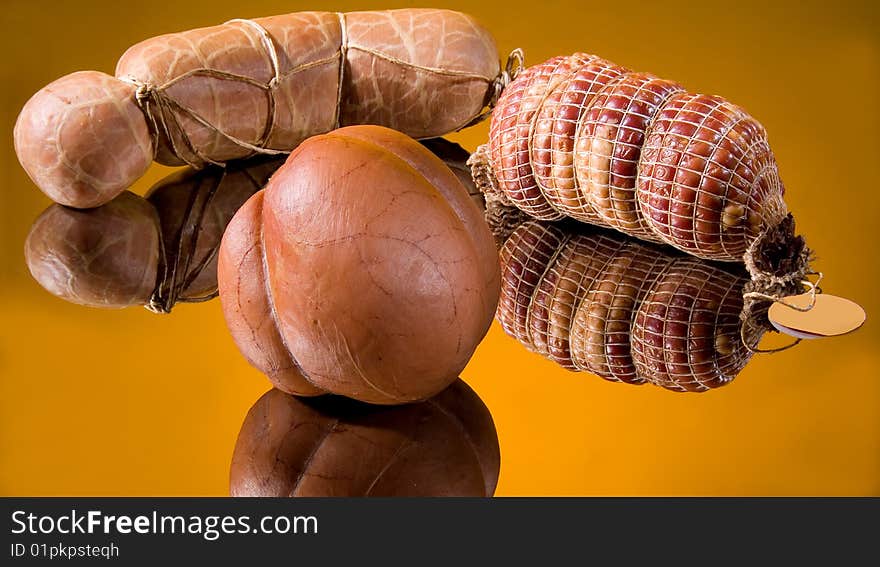 Sausages on a yellow glass background