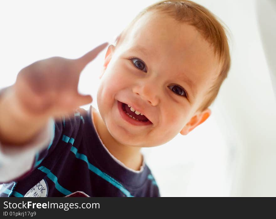 Closeup portrait of little boy smiling on white. Closeup portrait of little boy smiling on white