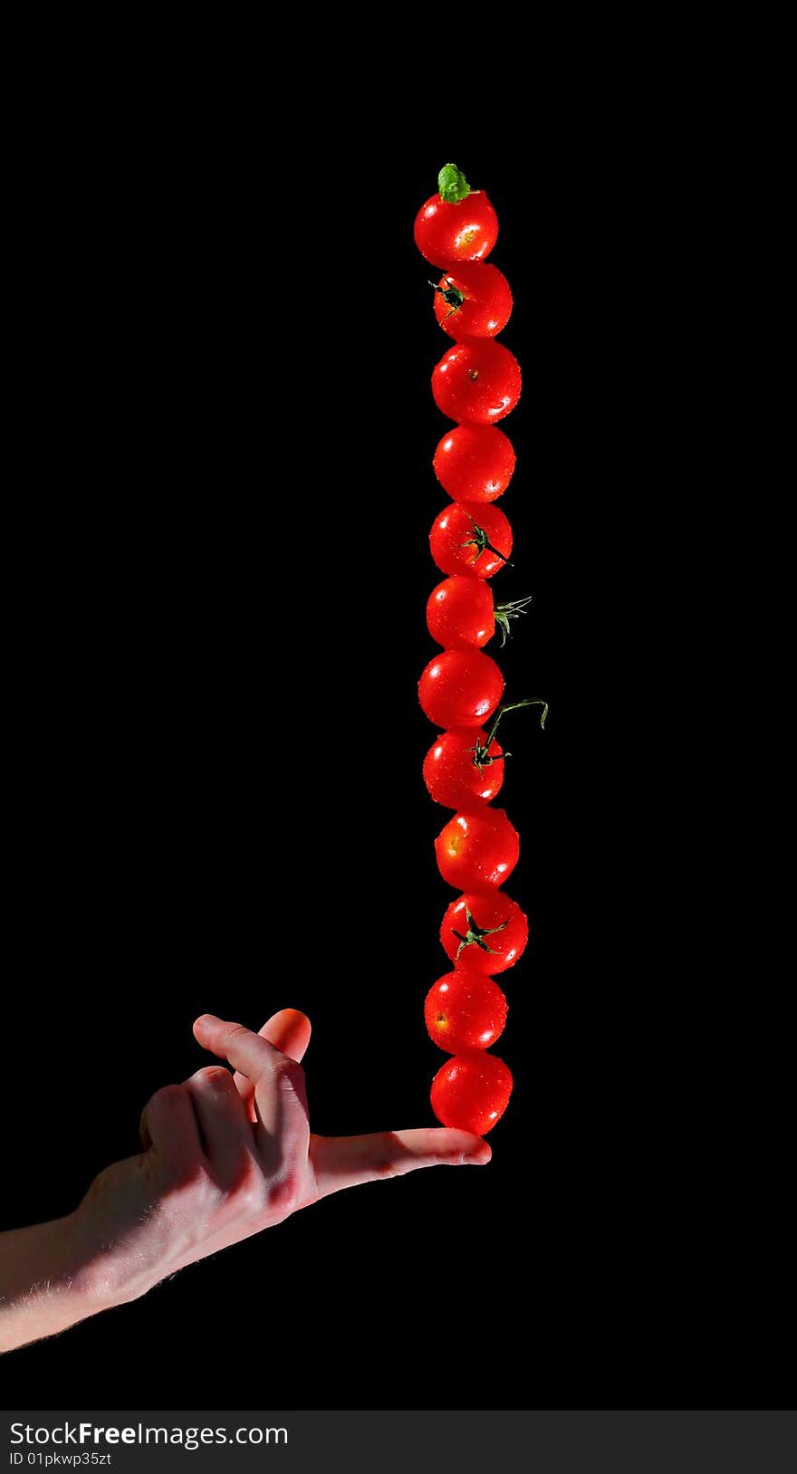 Vertical row of cherry tomatoes