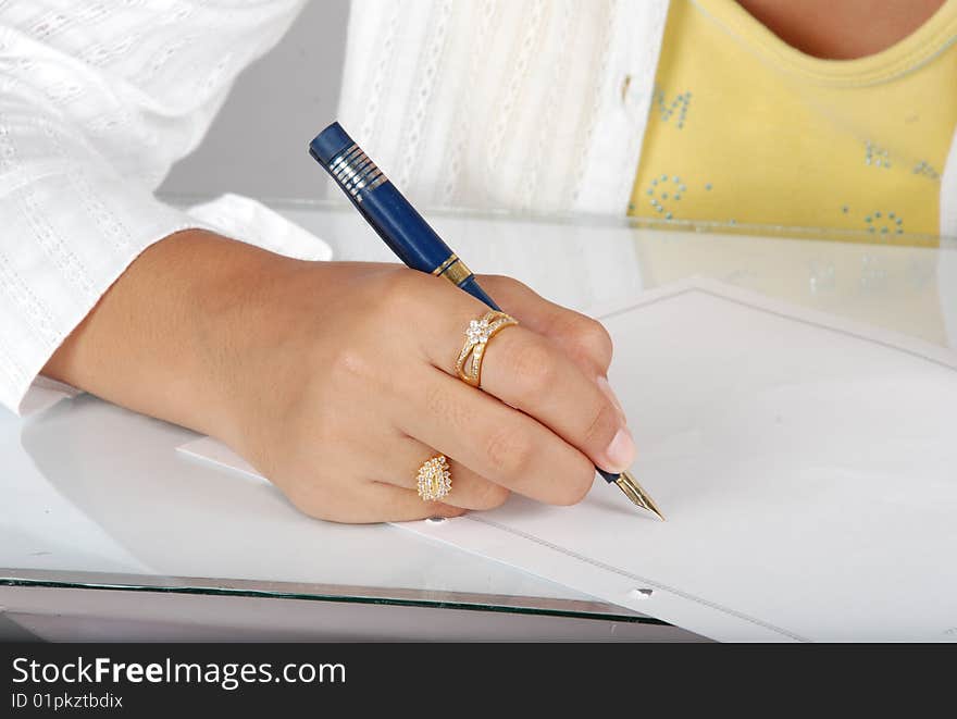 Girl writing on pad