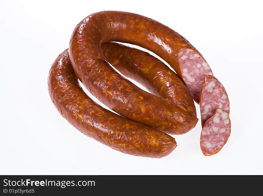 Piece of sausage on isolated background