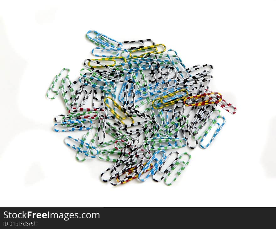 Group of colored paperclips isolated over white