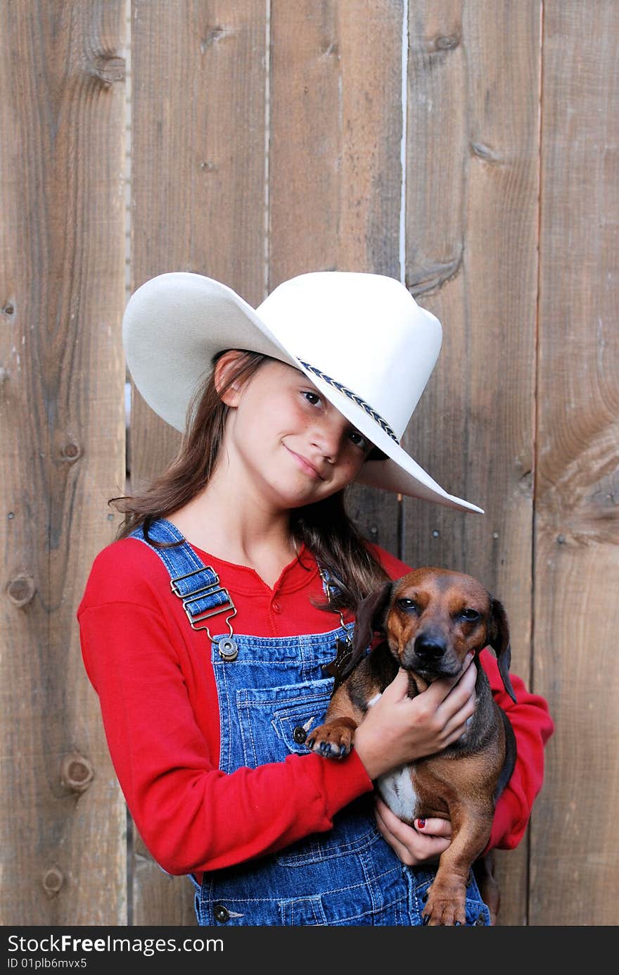 A cowgirl and her faithful sidekick strike their best pose. A cowgirl and her faithful sidekick strike their best pose.