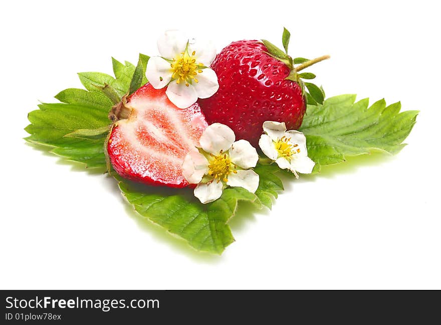 Strawberry slice and blossom isolated on white background