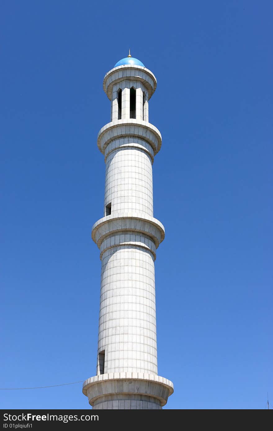 The high marble minaret in Almaty, Kazakhstan. The high marble minaret in Almaty, Kazakhstan